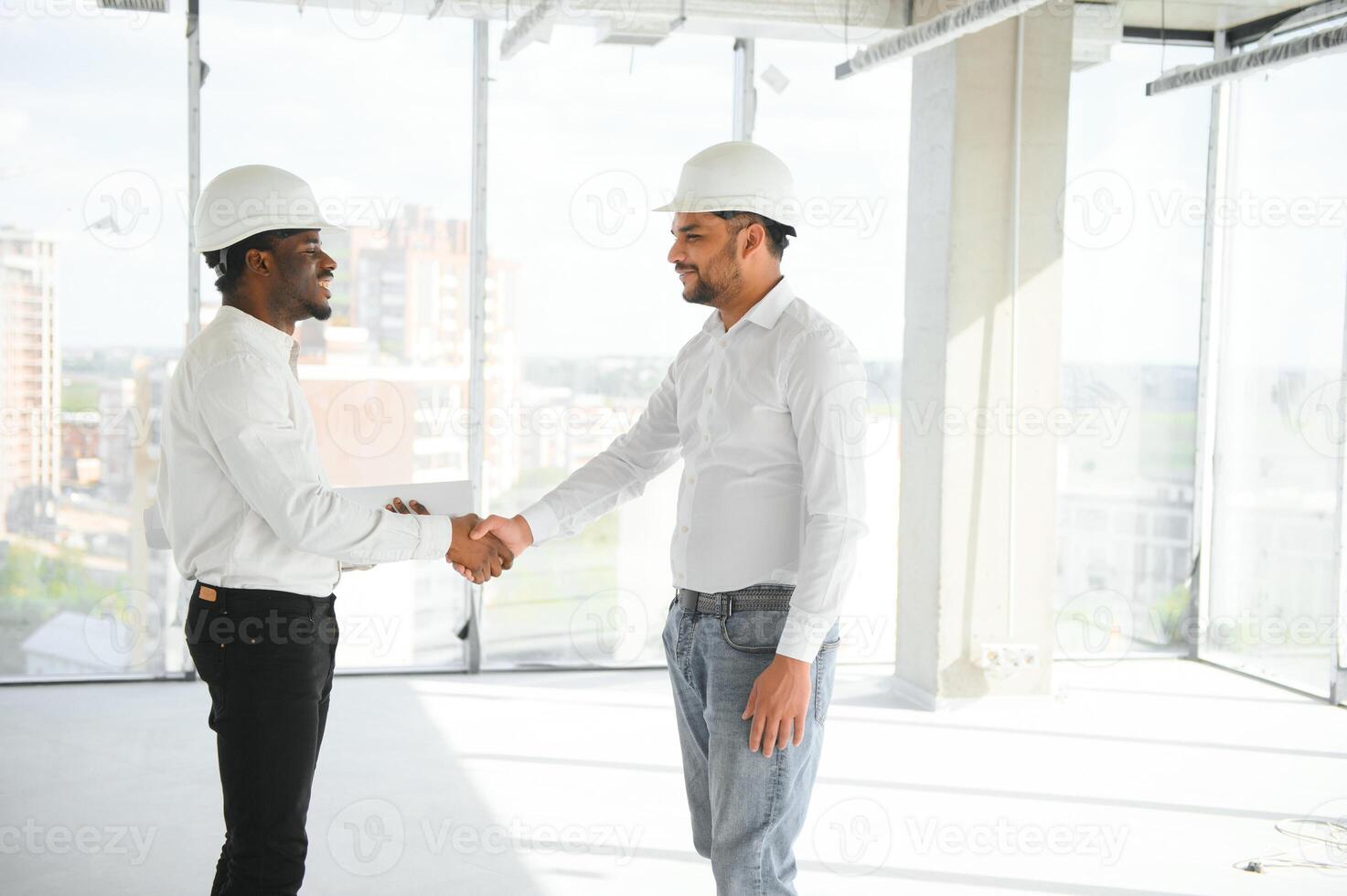 Group of multi ethnic engineer construction site worker meeting at workplace photo