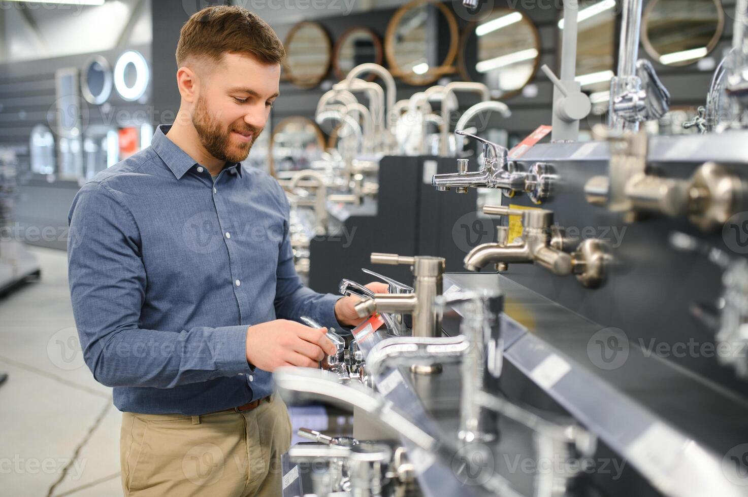 Man chooses a products in a sanitary ware store photo