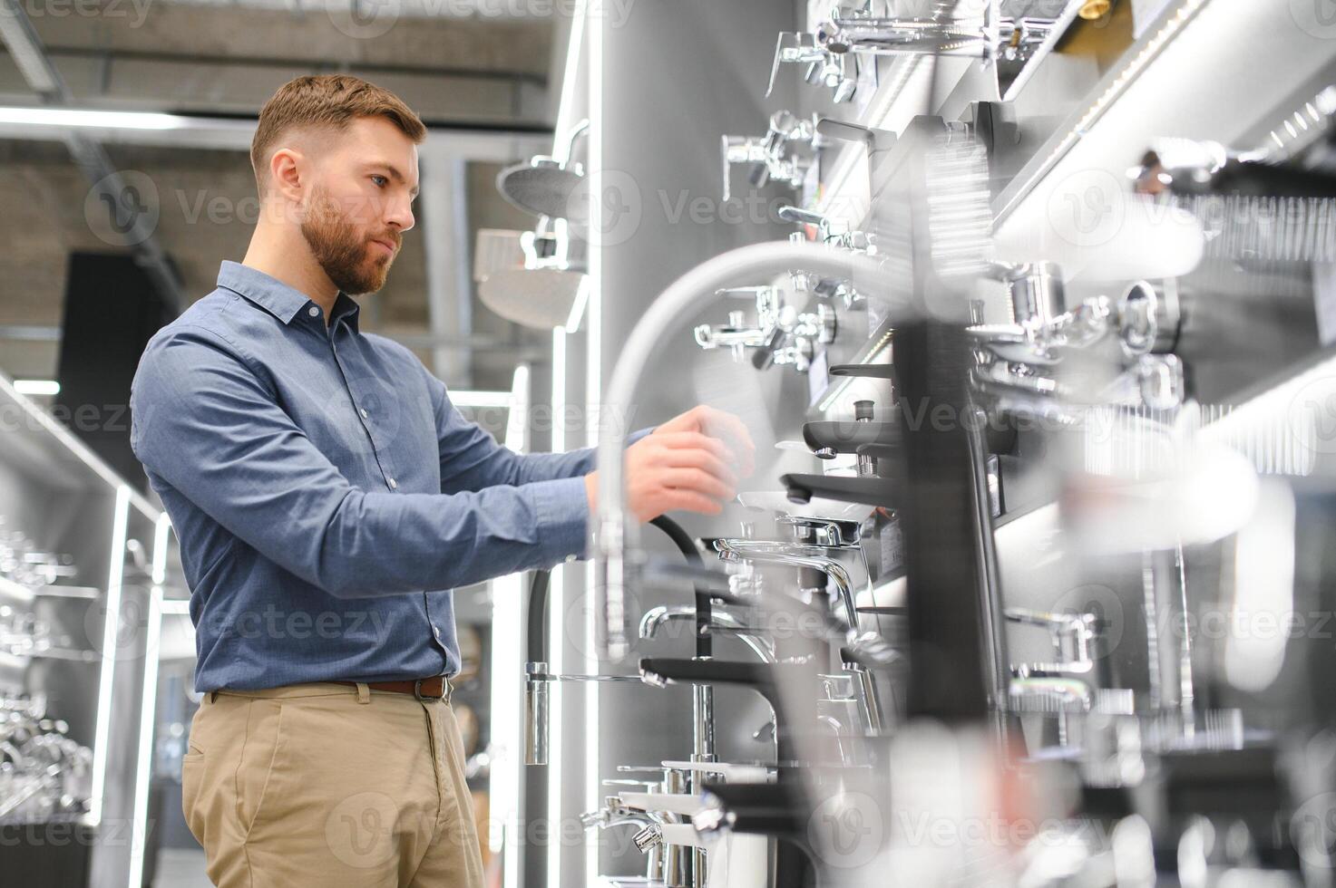 Man chooses a products in a sanitary ware store photo