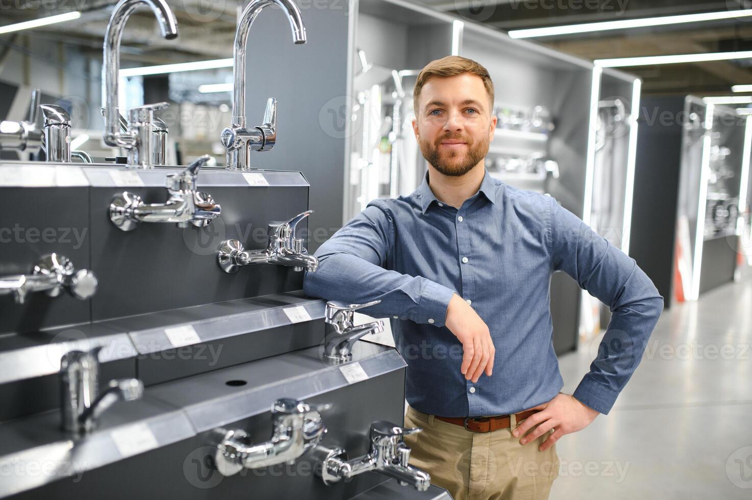Man chooses a products in a sanitary ware store photo