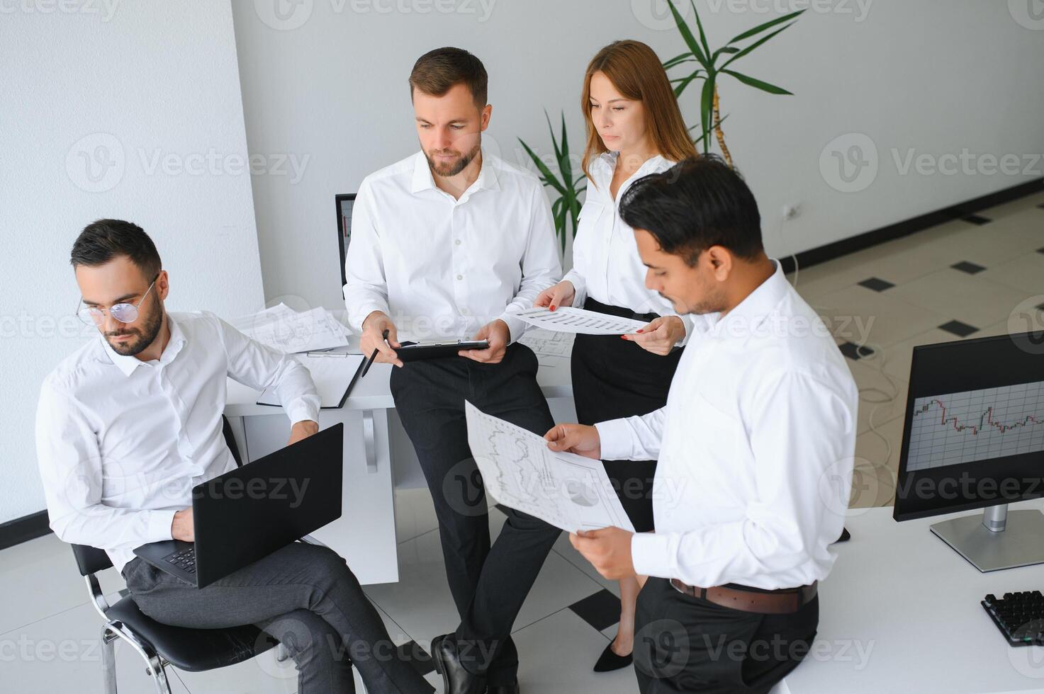 Business team working on their business project together at office. photo
