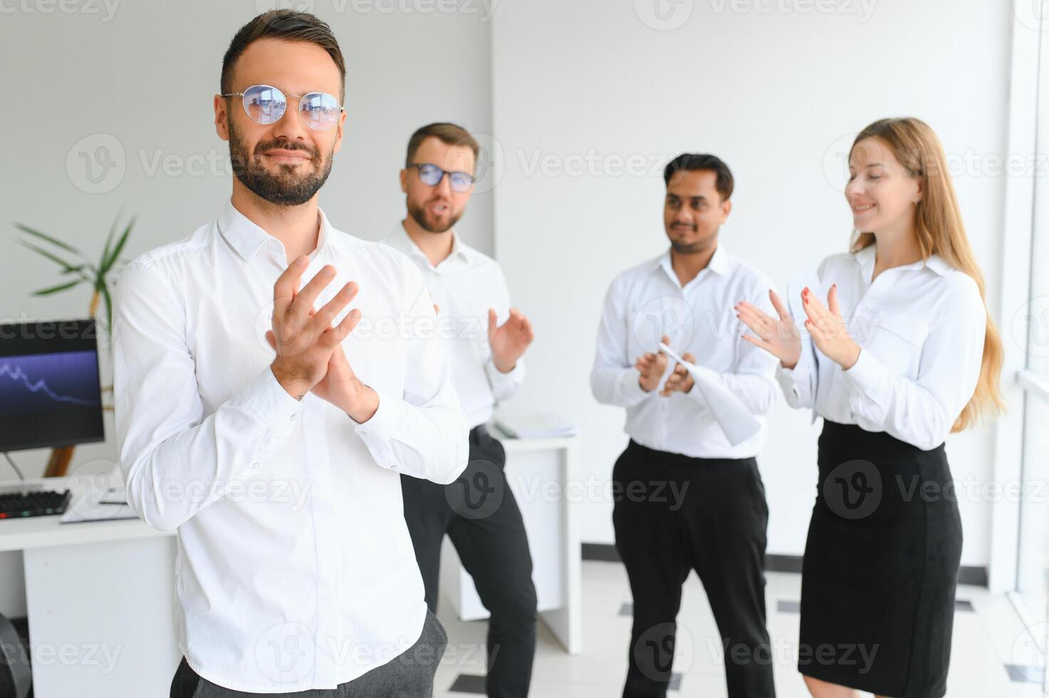 Business people stand on the background of the office corridor photo
