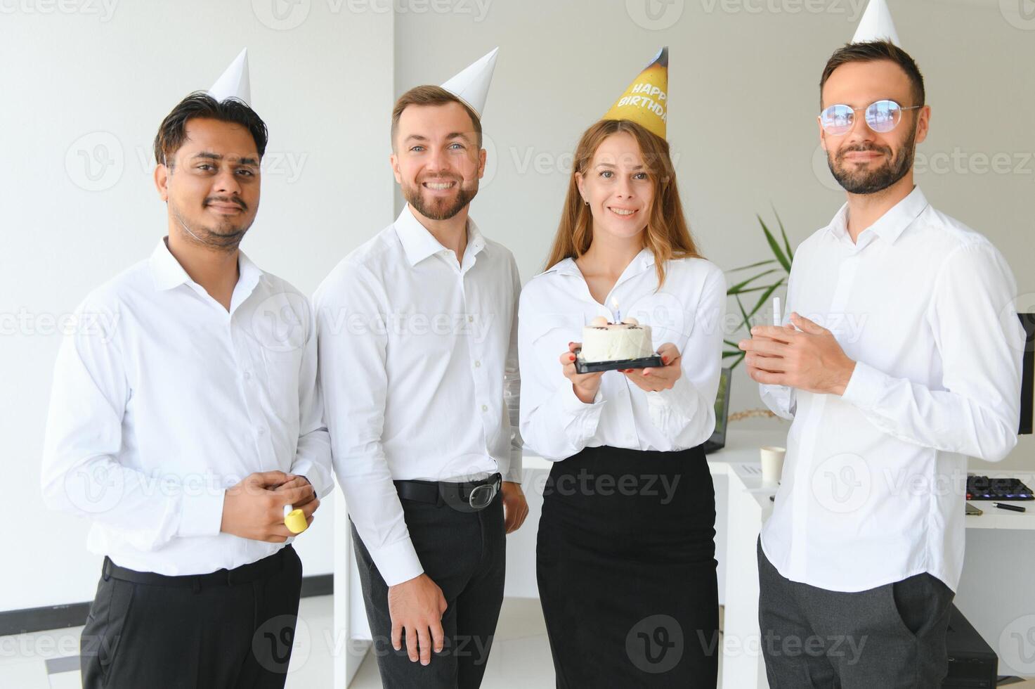 Business team celebrating a birthday of collegue in the modern office. photo
