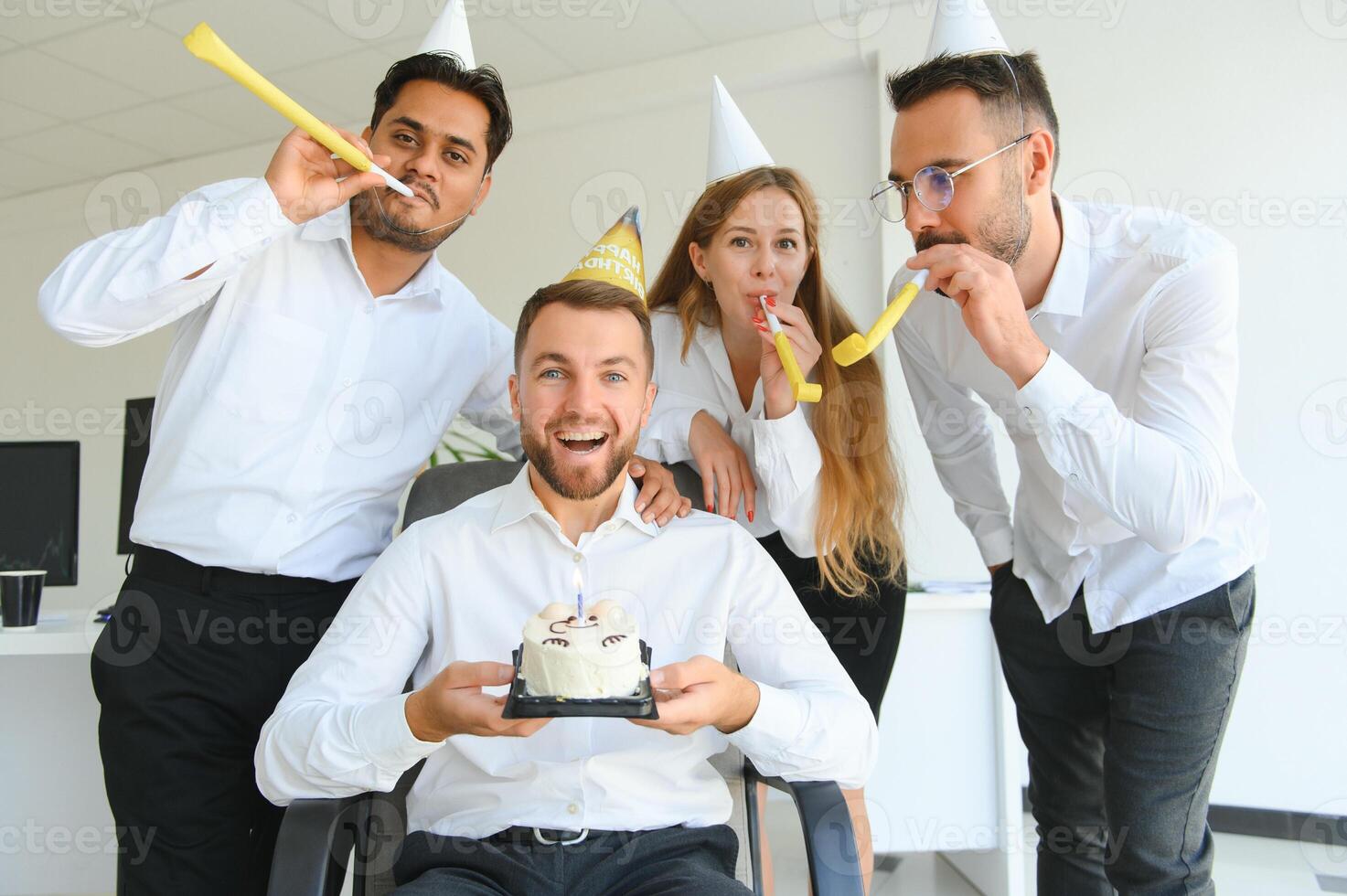 Business team celebrating a birthday of collegue in the modern office. photo
