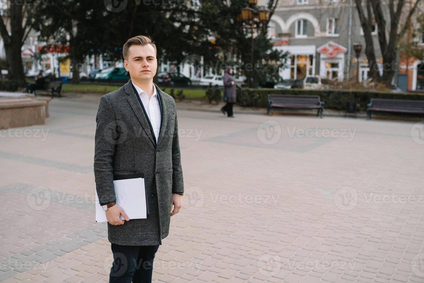 Young business man with documents. photo