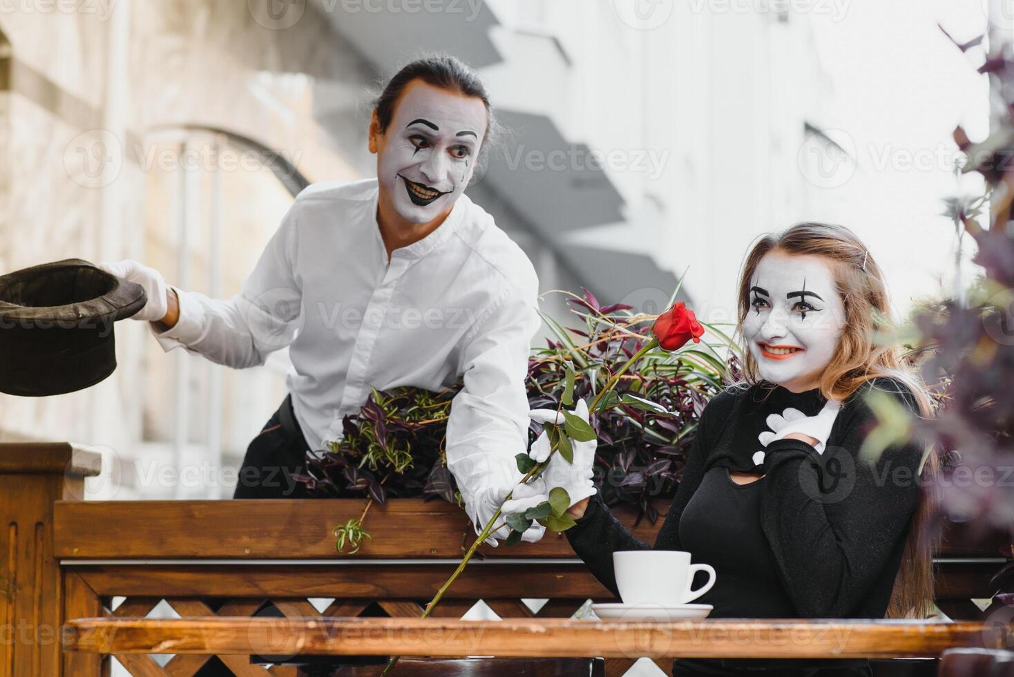 Mime on the street waiting to meet with his lover. Portrait of a mime comedian. mime on the street photo