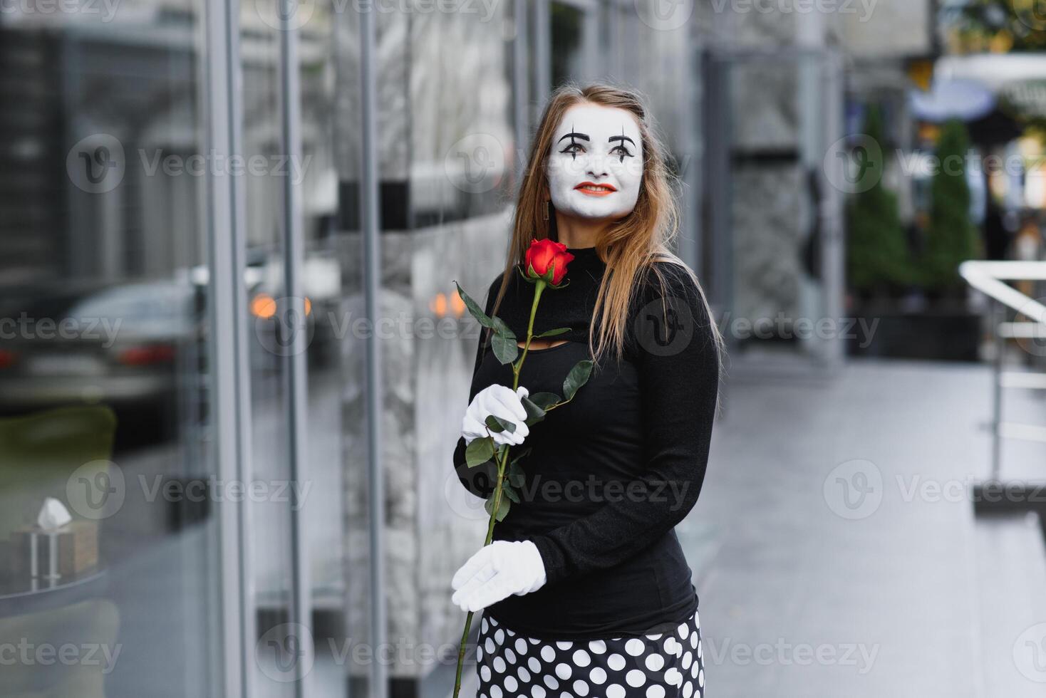 The girl with makeup of the mime. improvisation. mime shows different emotions photo