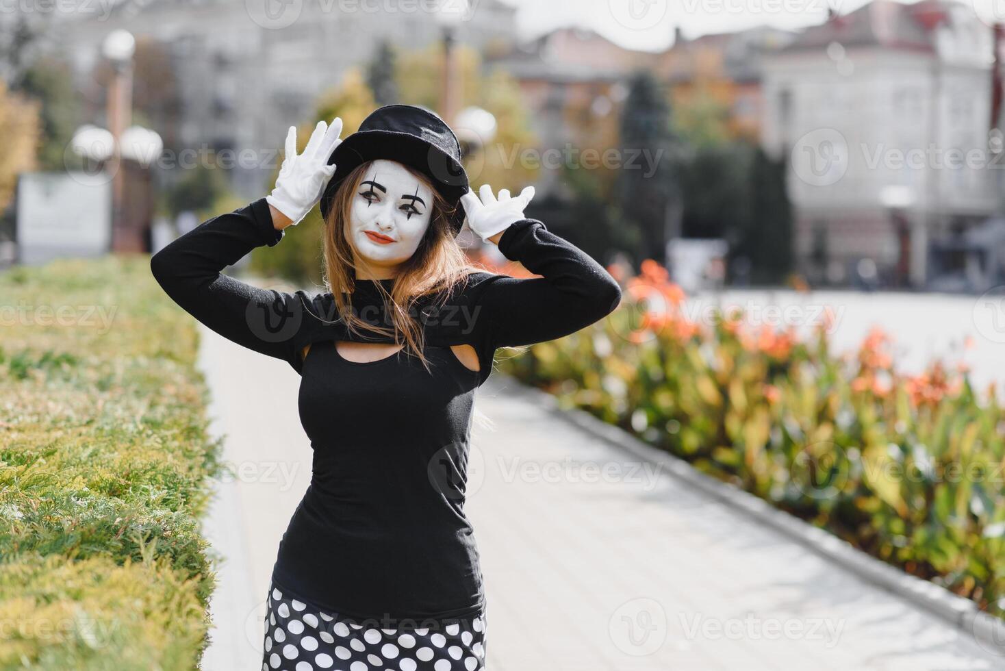 The girl with makeup of the mime. improvisation. mime shows different emotions photo