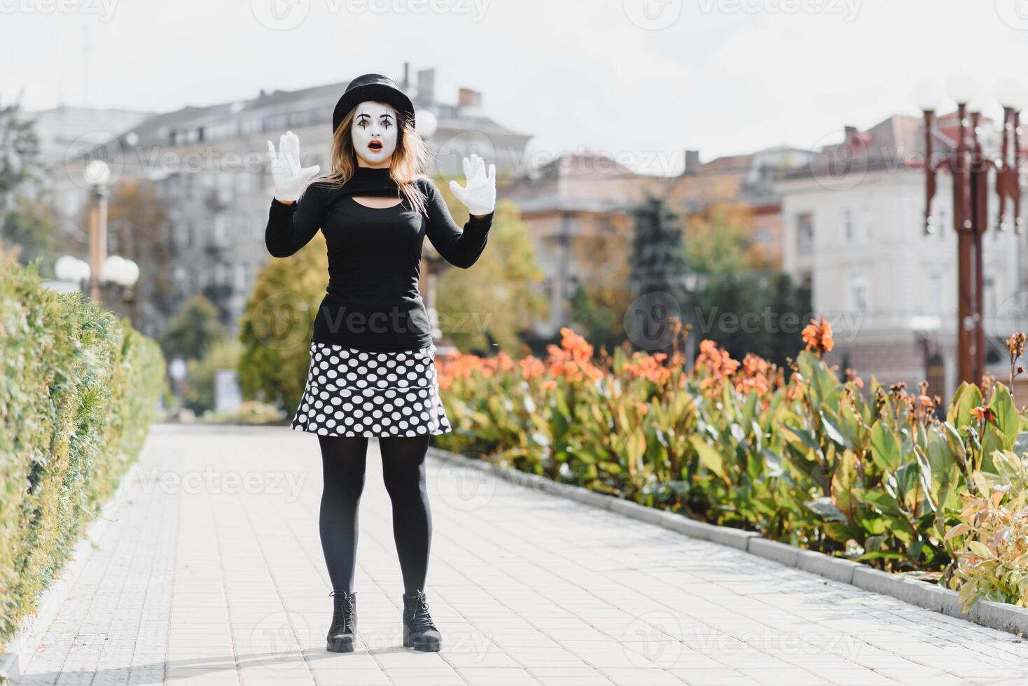 Portrait of a mime comedian. mime girl on the street photo