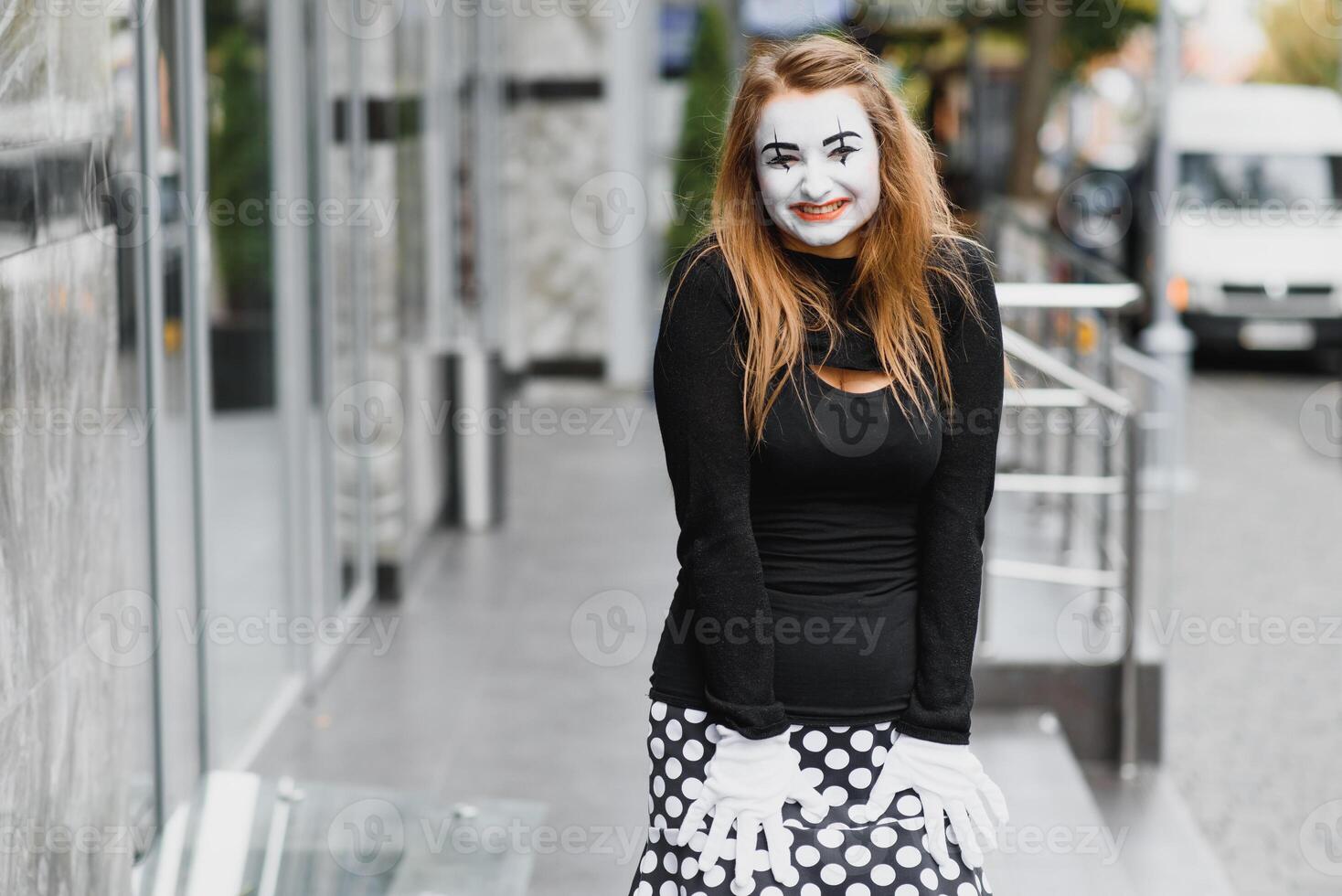 The girl with makeup of the mime. improvisation. mime shows different emotions photo
