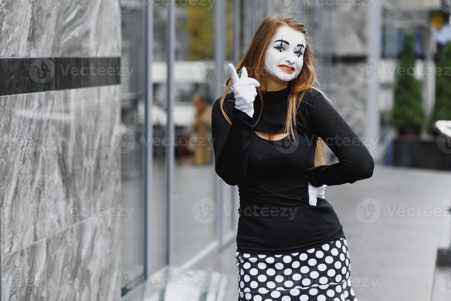 The girl with makeup of the mime. improvisation. mime shows different emotions photo