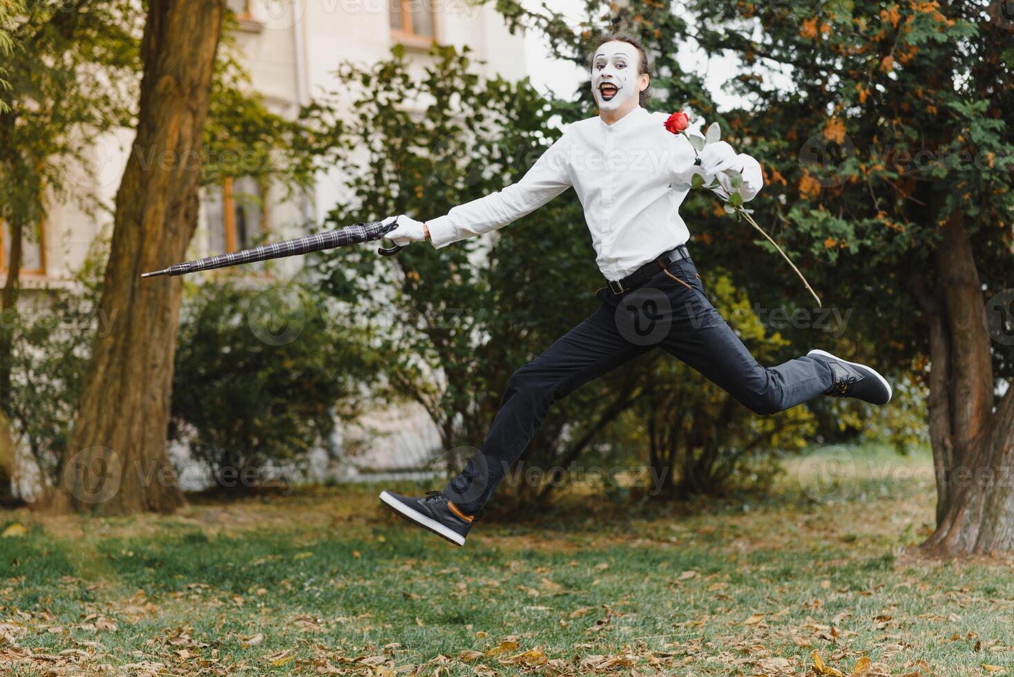 Portrait of a man, artist,clown, MIME. Shows something. Mime actor shows different emotions. photo