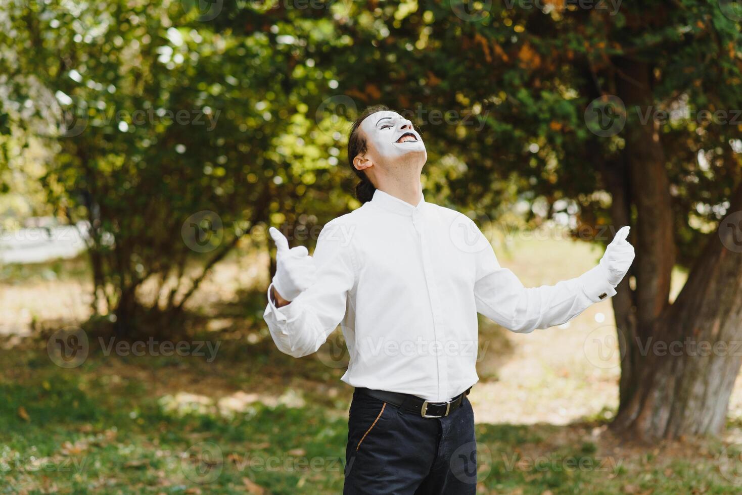 young Funny mime shows something. photo