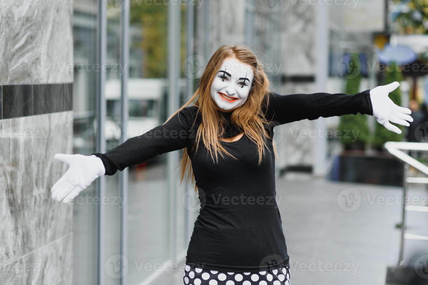 Portrait of a mime comedian. mime girl on the street photo