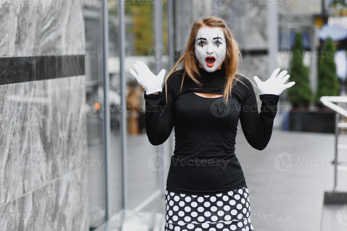 Portrait of a mime comedian. mime girl on the street photo