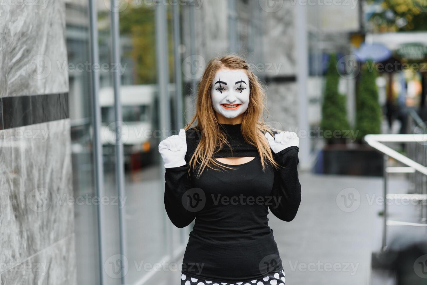 The girl with makeup of the mime. improvisation. mime shows different emotions photo