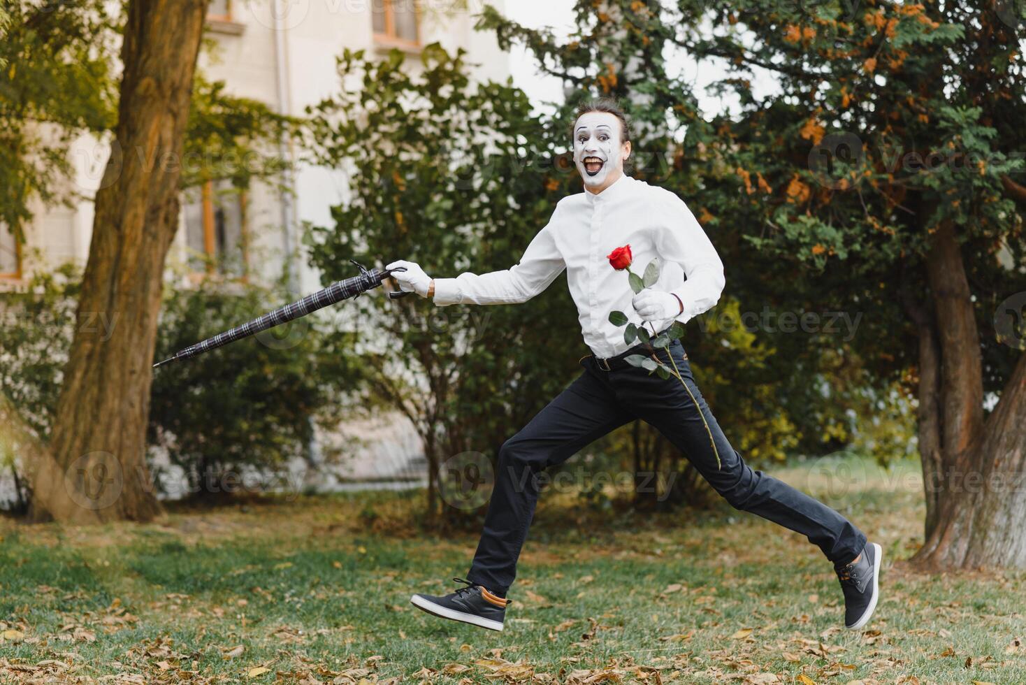 Portrait of a man, artist,clown, MIME. Shows something. Mime actor shows different emotions. photo