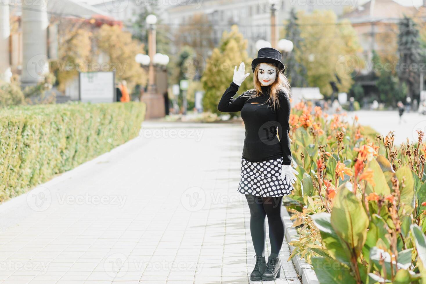 Portrait of a mime comedian. mime girl on the street photo
