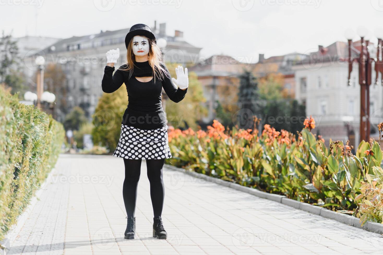 The girl with makeup of the mime. improvisation. mime shows different emotions photo