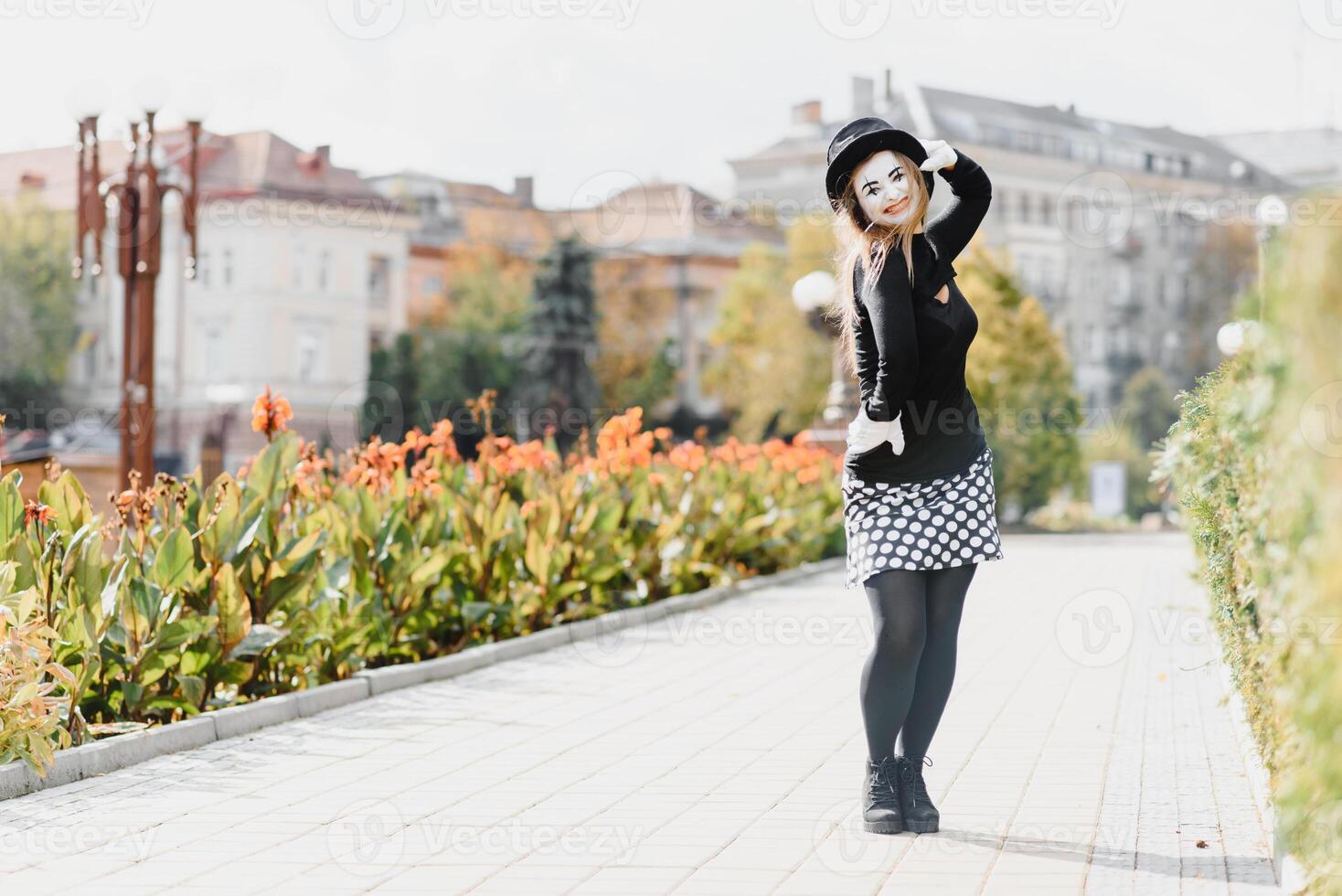 Portrait of a mime comedian. mime girl on the street photo