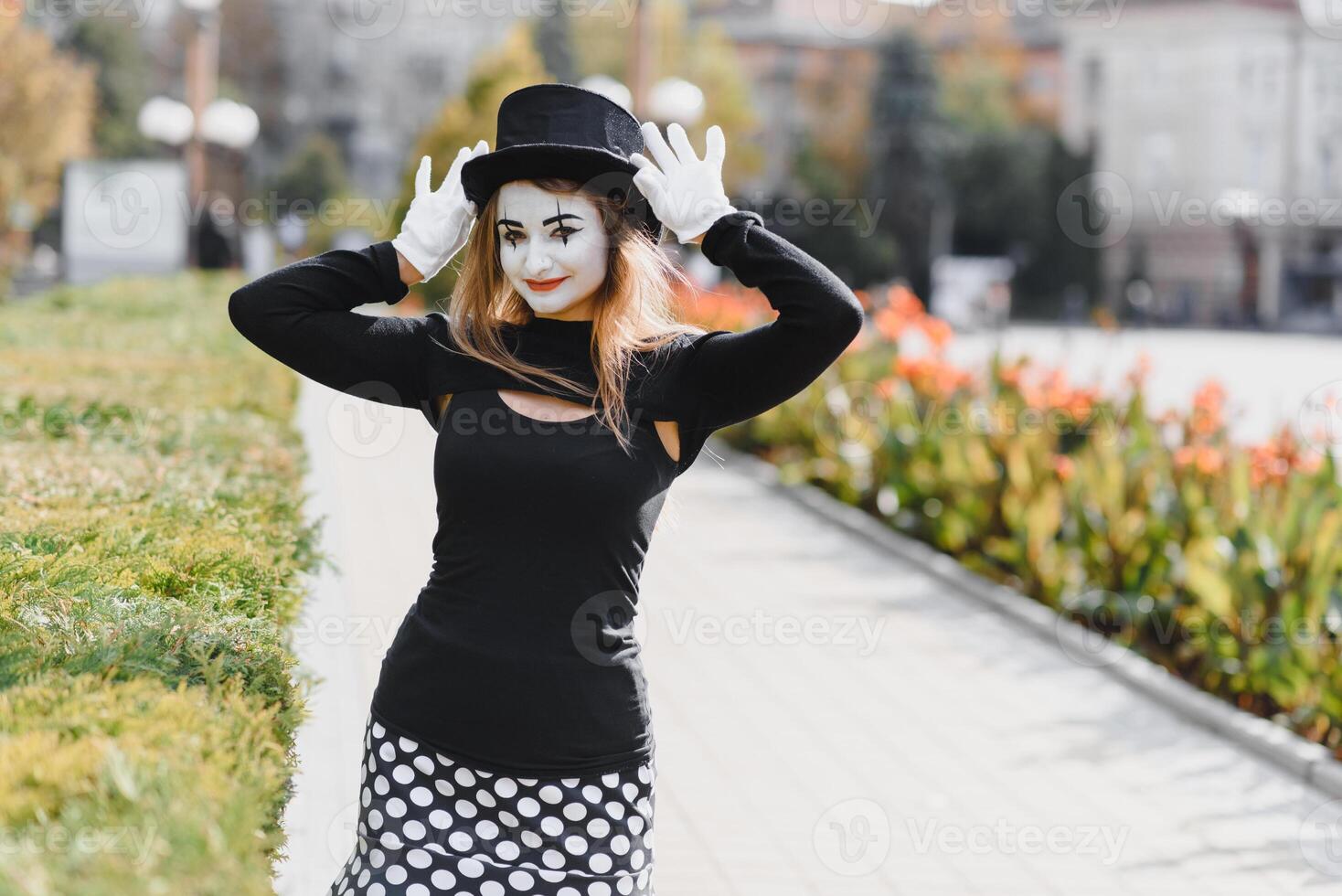 Portrait of a mime comedian. mime girl on the street photo