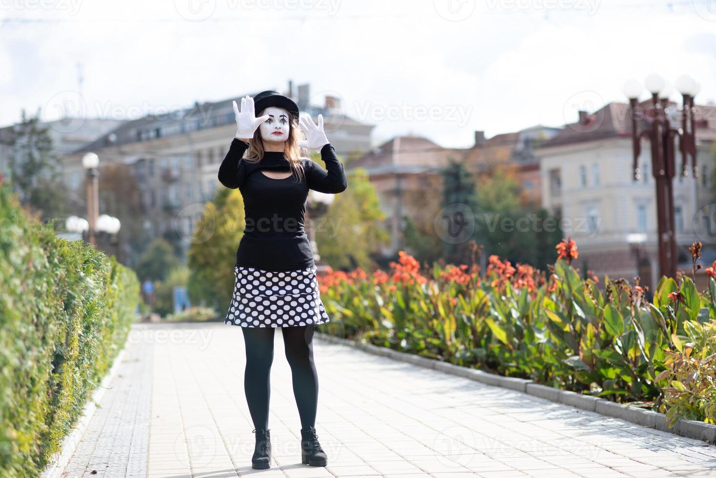 The girl with makeup of the mime. improvisation. mime shows different emotions photo