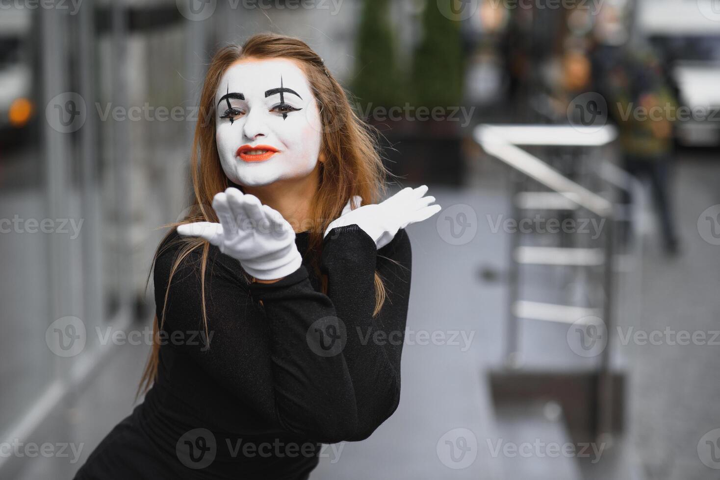 The girl with makeup of the mime. improvisation. mime shows different emotions photo