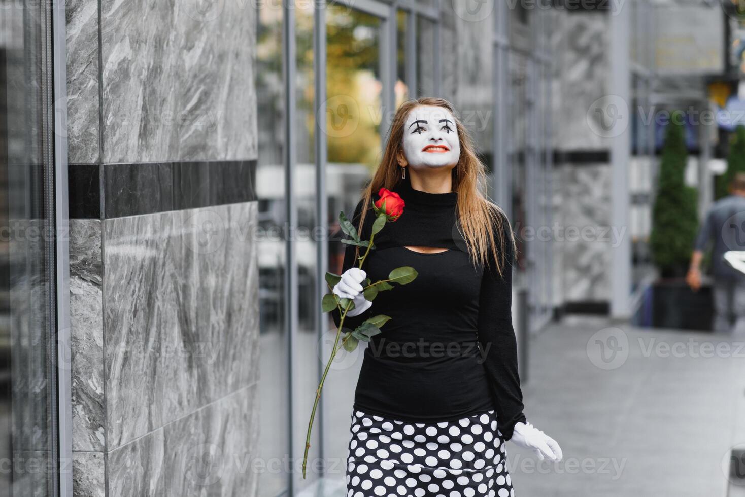 woman mime with red rose photo