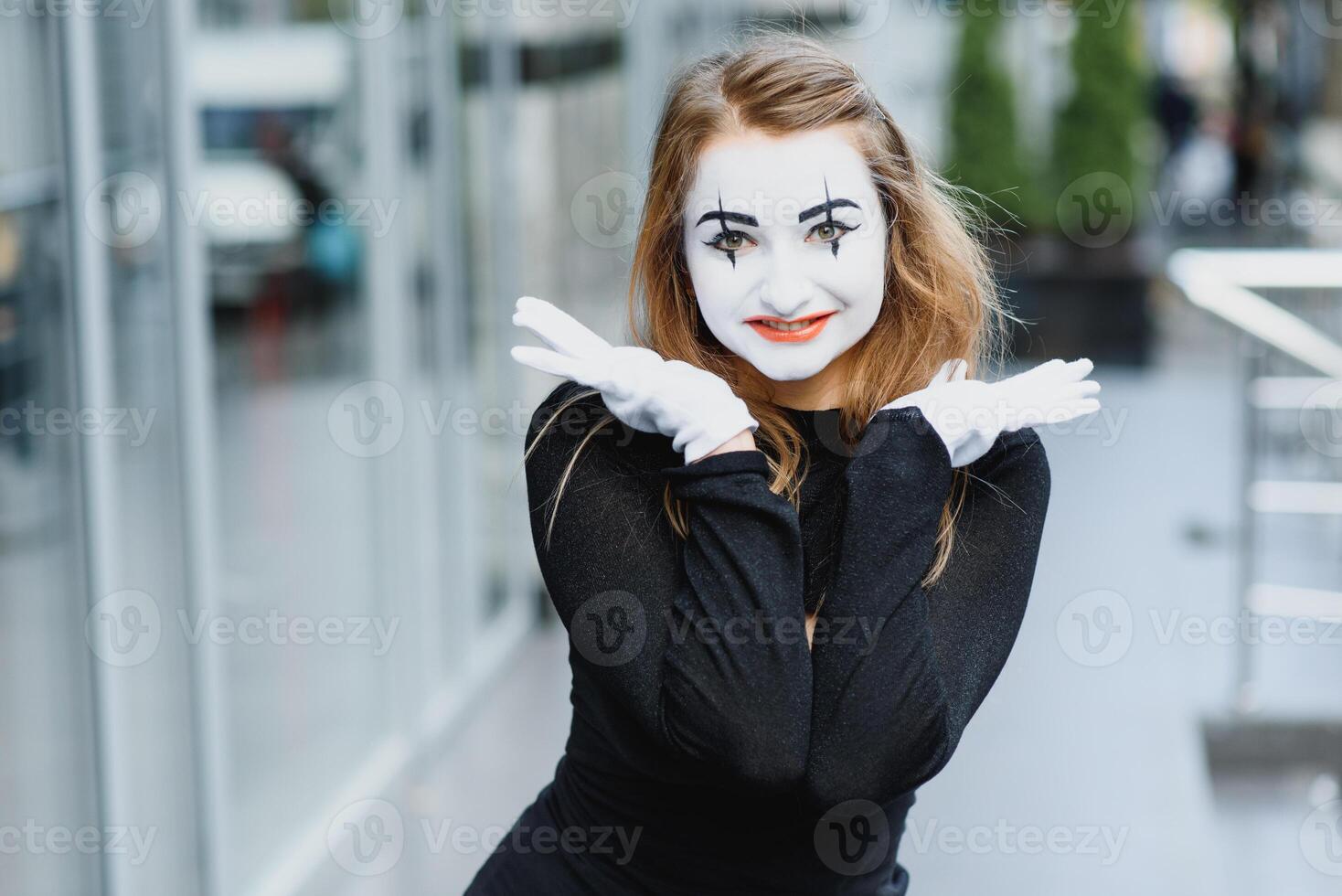 Portrait of a mime comedian. mime girl on the street photo