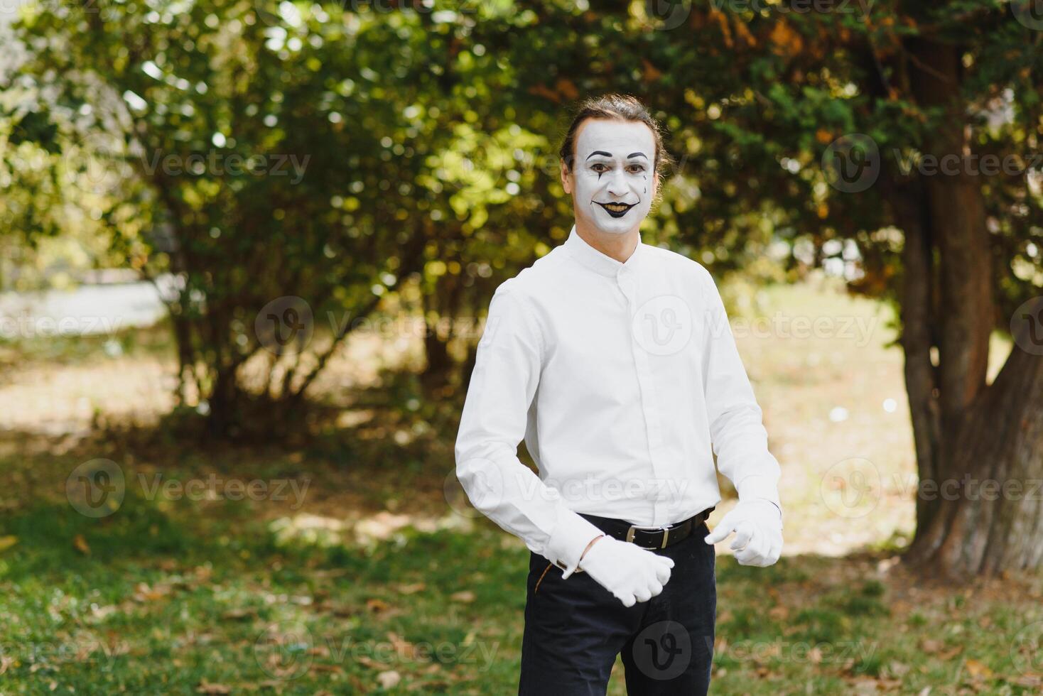 Portrait of a man, artist,clown, MIME. Shows something. Mime actor shows different emotions. photo
