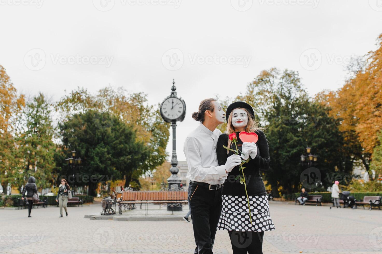 Mime on the street waiting to meet with his lover. Portrait of a mime comedian. mime on the street photo