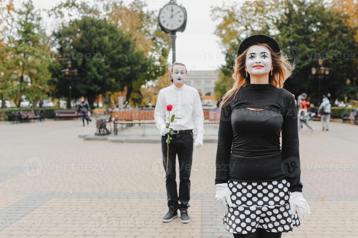 Mime on the street waiting to meet with his lover. Portrait of a mime comedian. mime on the street photo
