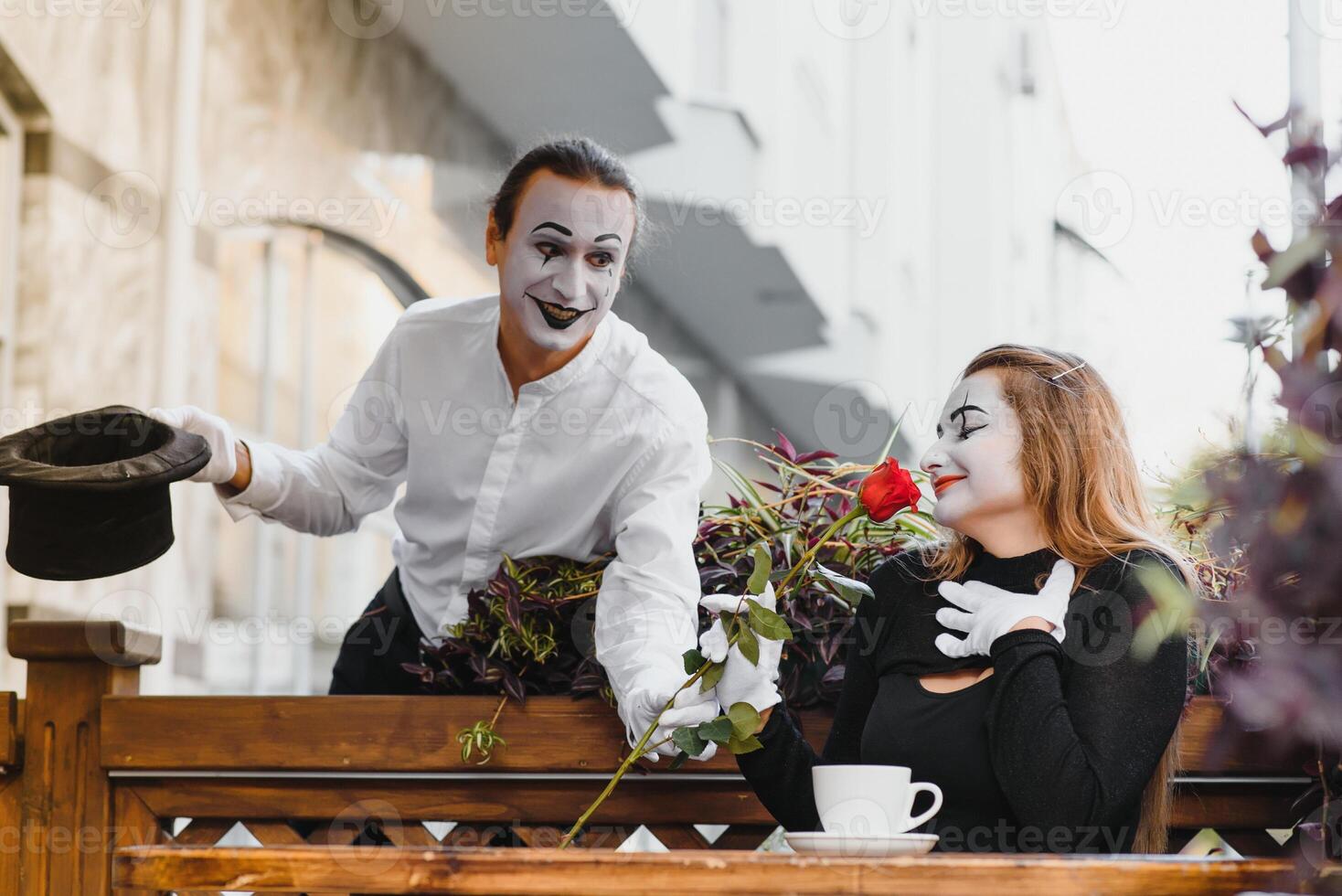 Mime on the street waiting to meet with his lover. Portrait of a mime comedian. mime on the street photo