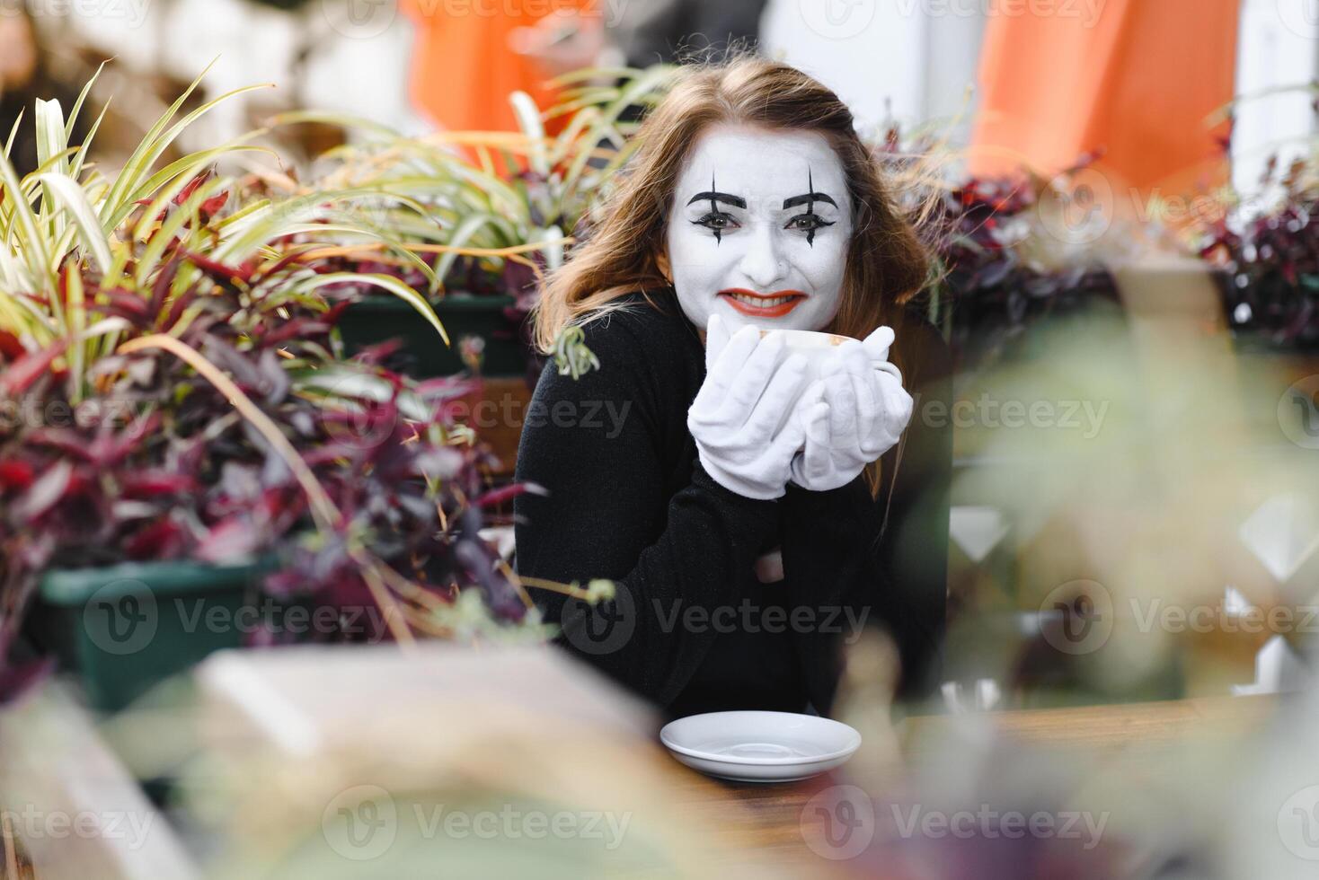 Portrait of a mime comedian. mime girl on the street photo