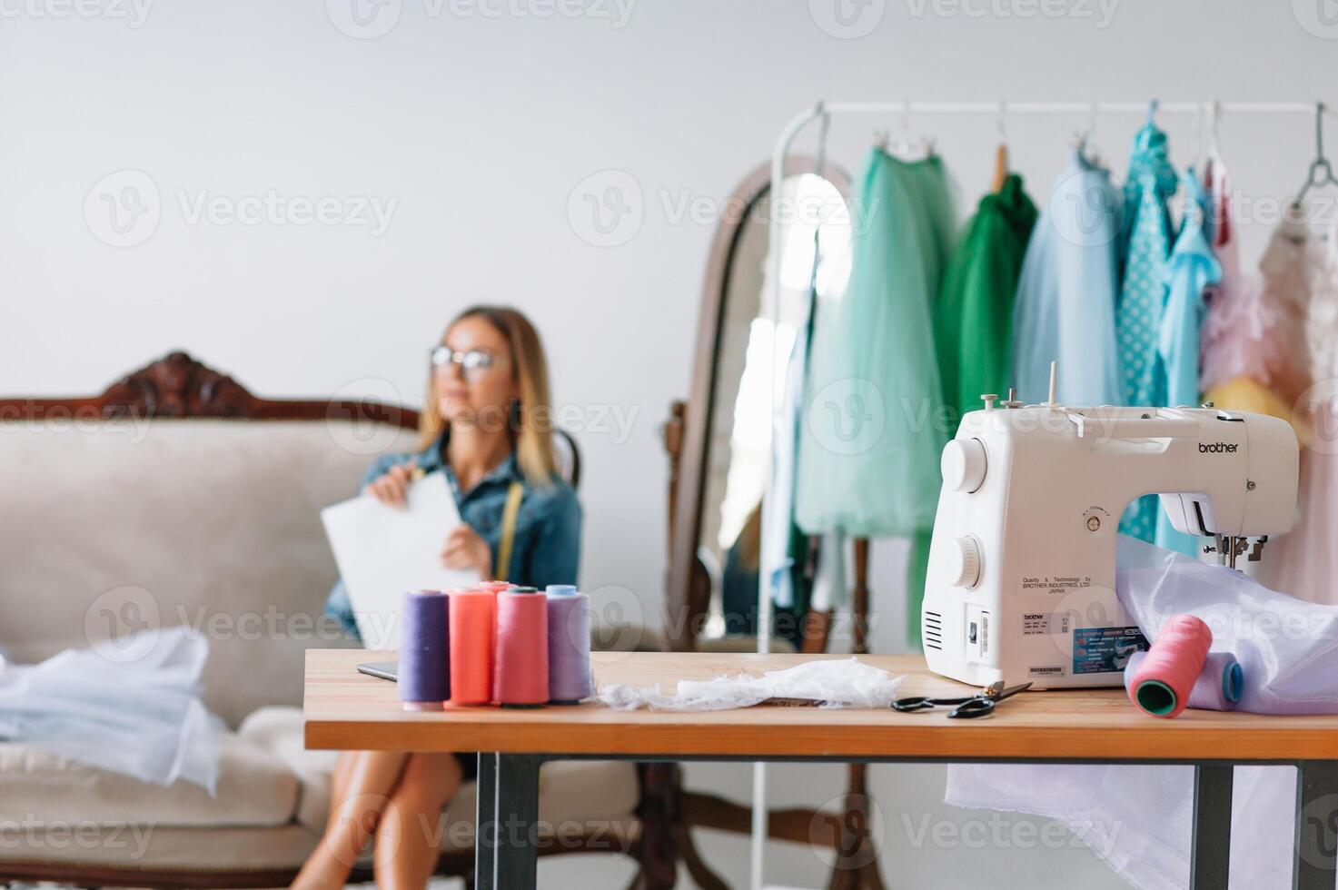 Fashion designer working on her designs in the studio photo