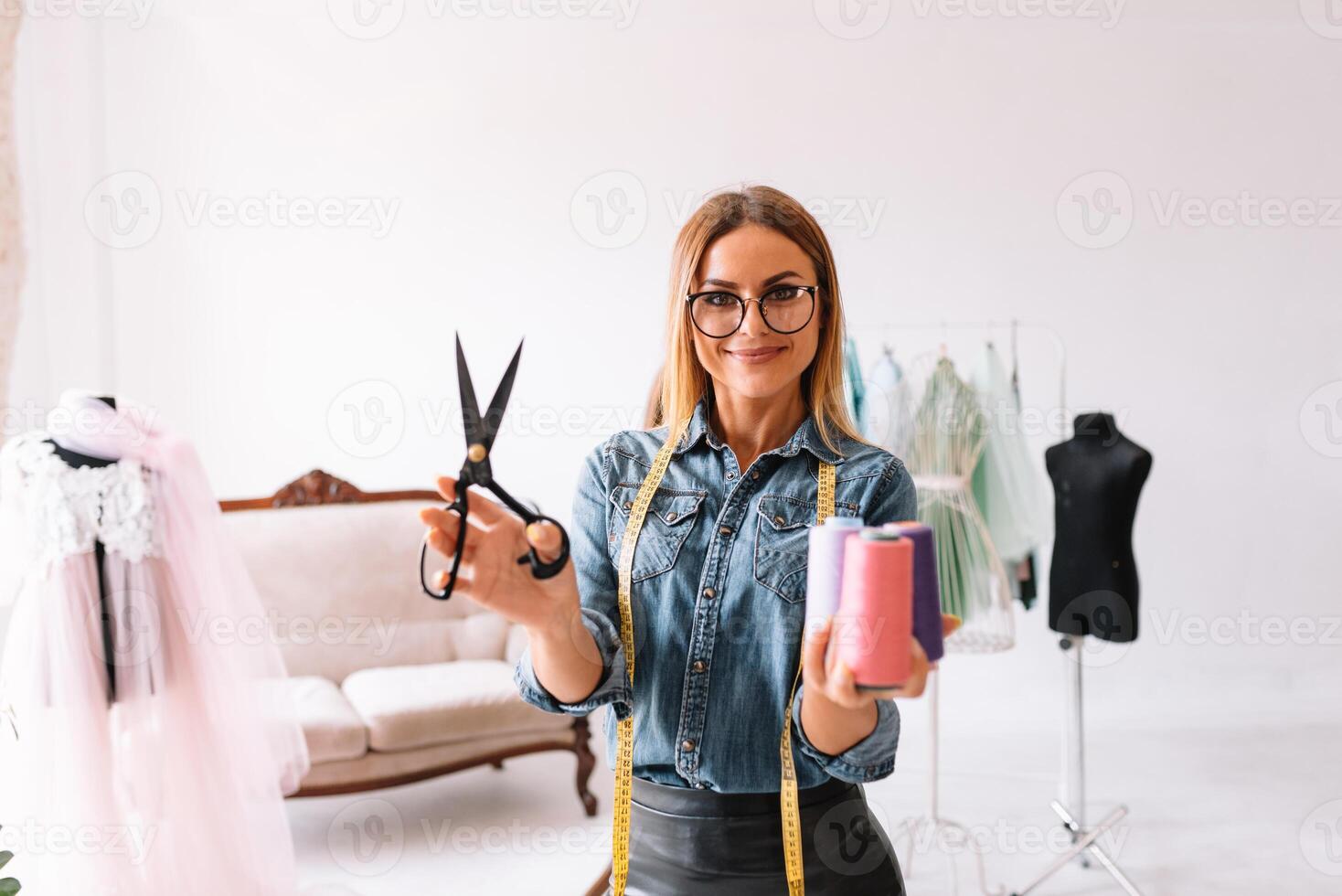 Fashion designer working in the studio photo
