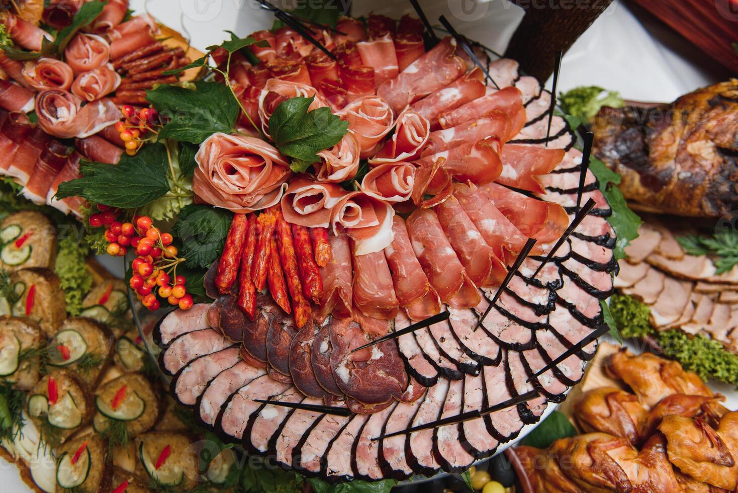 Meat and cheese appetizers. Antipasti and catering platter with different meat and cheese products. photo