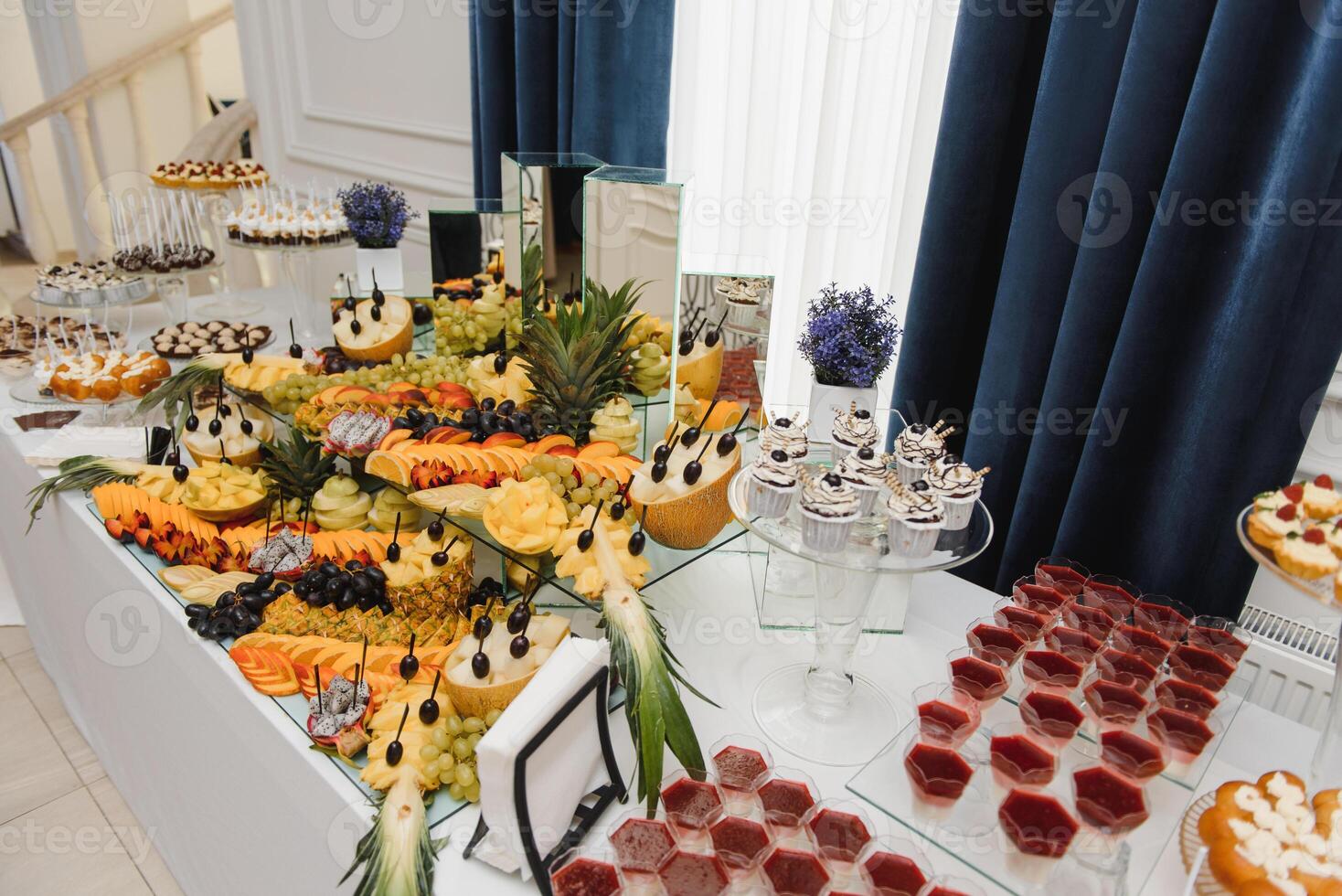 Delicious sweets on wedding candy buffet with desserts, cupcakes,tiramisu and cookies photo