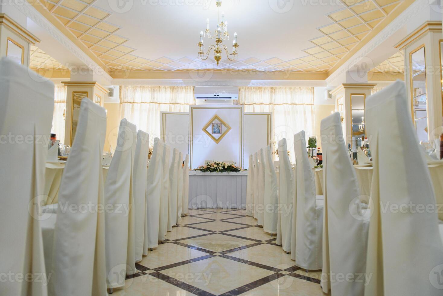 an image of tables setting at a luxury wedding hall photo