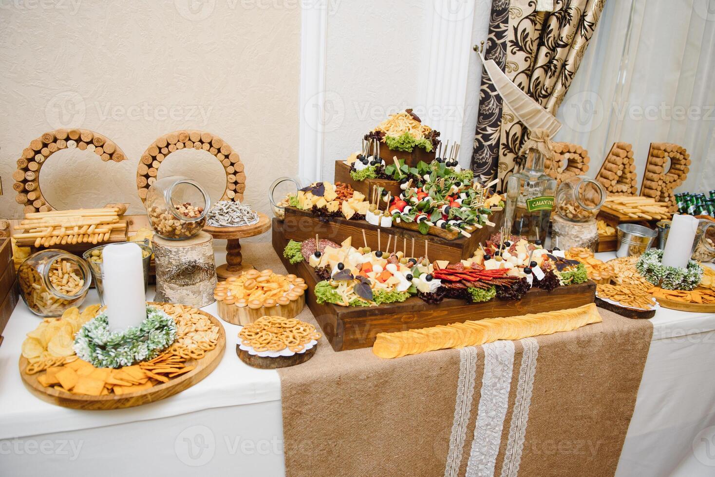Meat and cheese appetizers. Antipasti and catering platter with different meat and cheese products. photo