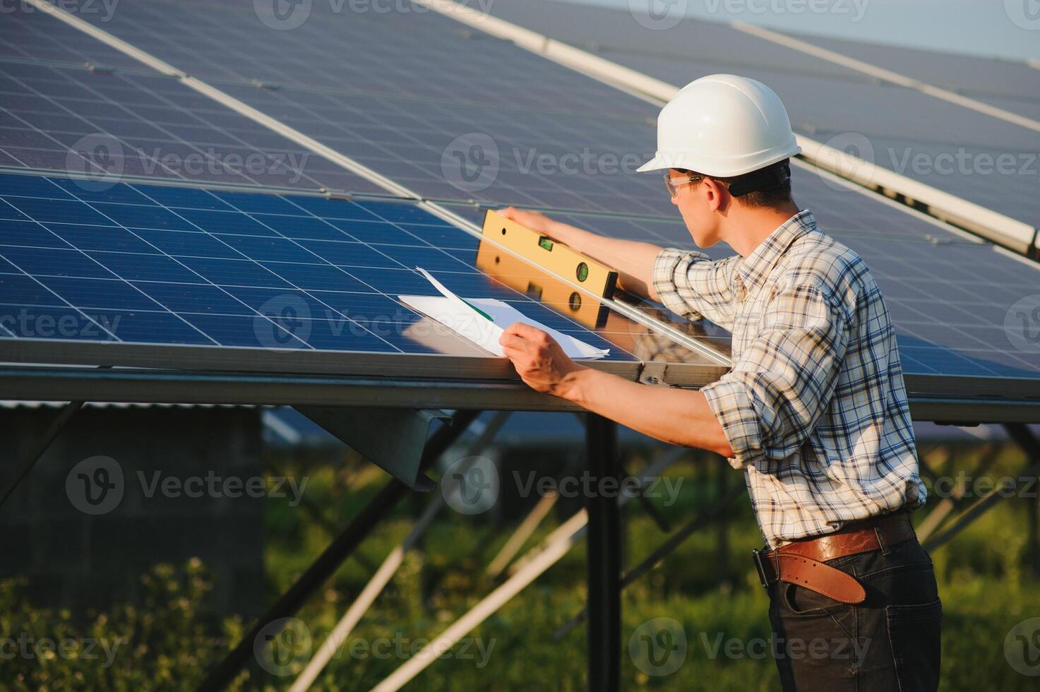 Renewable energy and solar power concept, worker or Electrical engineers are checking and training installing photovoltaic plant in solar power station alternative energy from nature photo