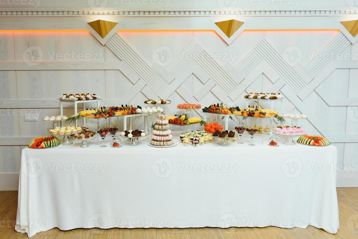 various dessert with fresh fruit on buffet line, sweet. photo