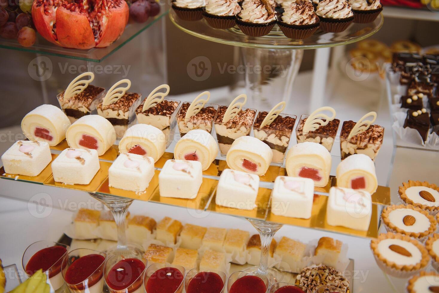 various dessert with fresh fruit on buffet line, sweet. photo