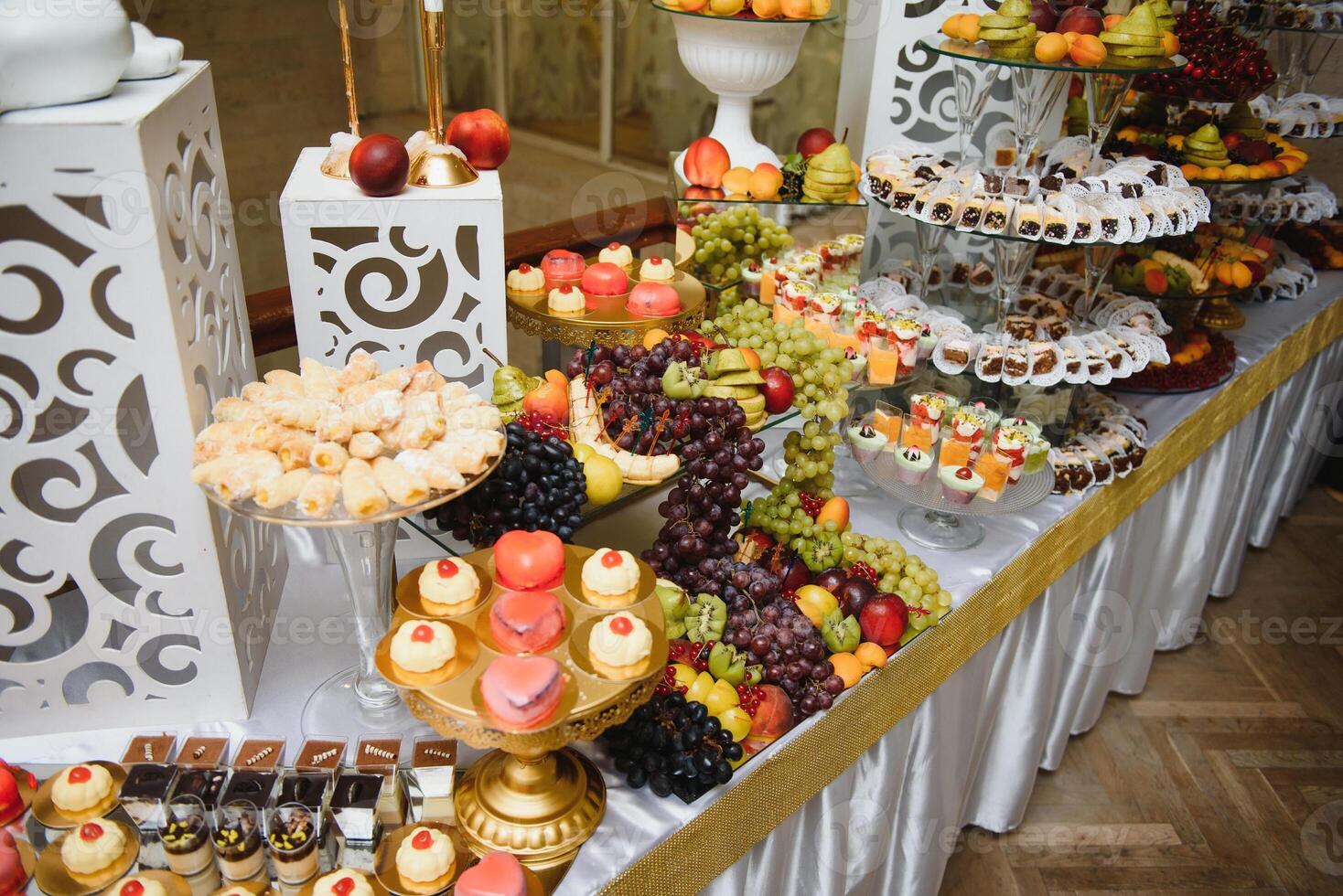 various dessert with fresh fruit on buffet line, sweet. photo