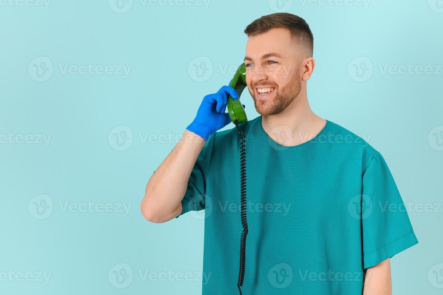 doctor with phone on a blue background. doctor call concept photo