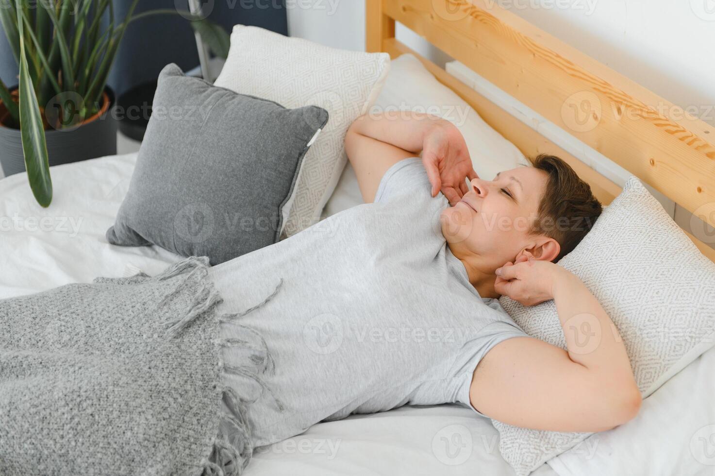 Closeup of woman asleep in bed. photo