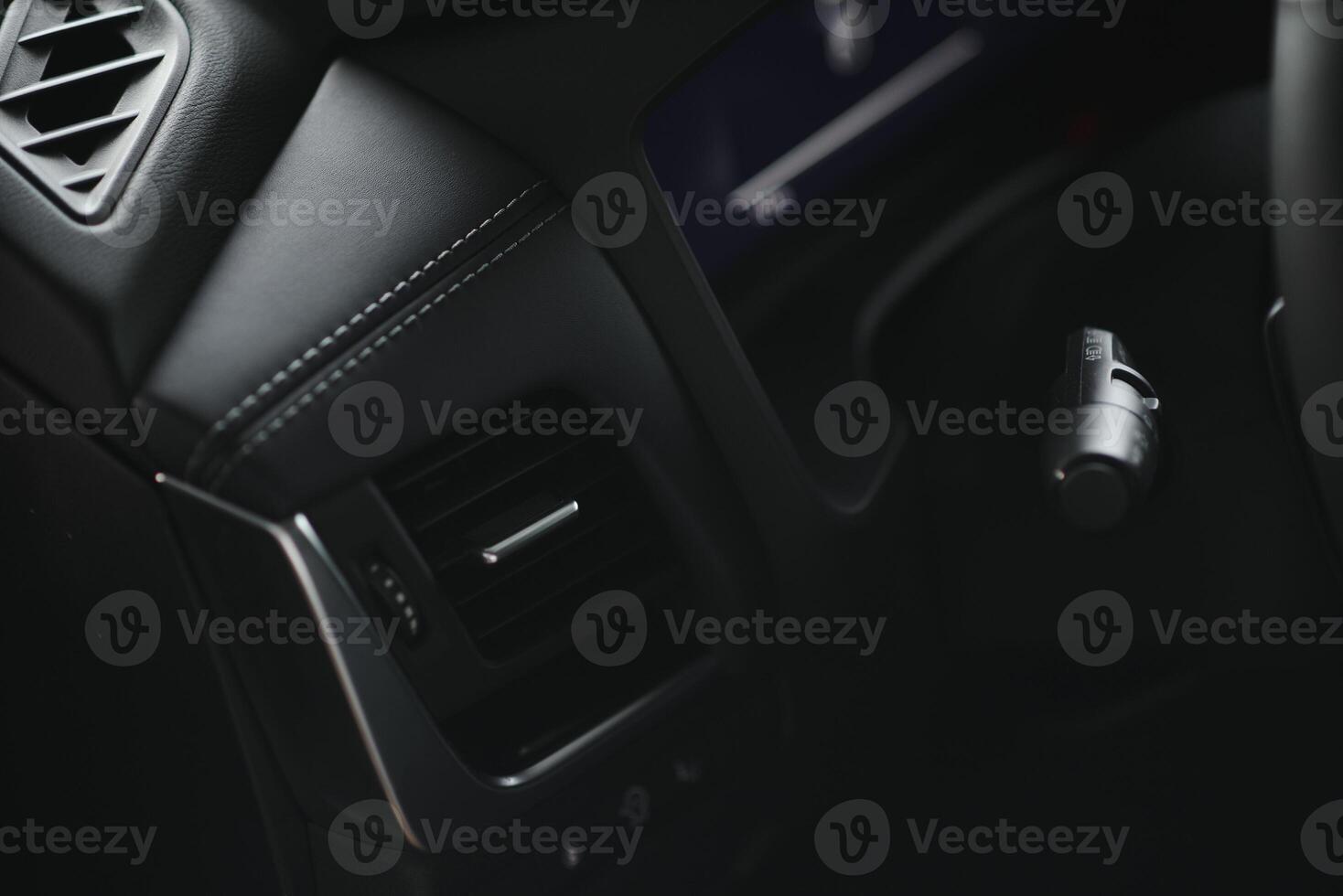 Luxury car interior. Steering wheel, shift lever and dashboard. photo