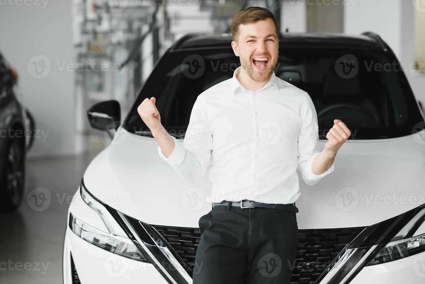 Man adult customer male buyer client chooses auto wants to buy new automobile touch check car in showroom vehicle salon dealership store motor show indoor. Sales concept photo