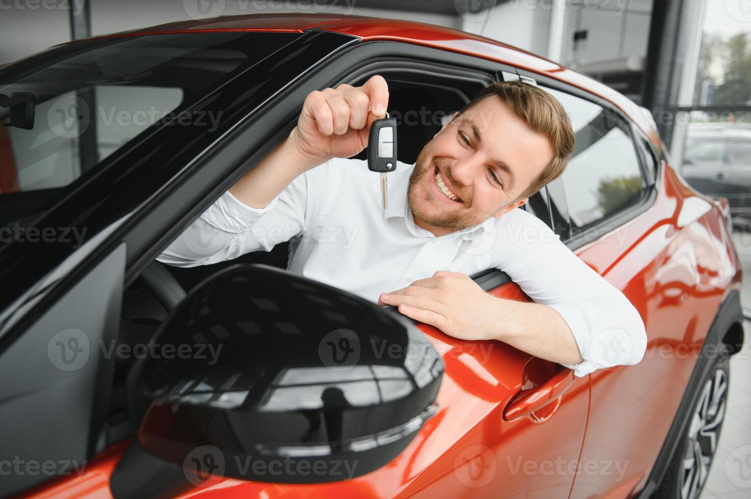 Man adult customer male buyer client chooses auto wants to buy new automobile touch check car in showroom vehicle salon dealership store motor show indoor. Sales concept photo