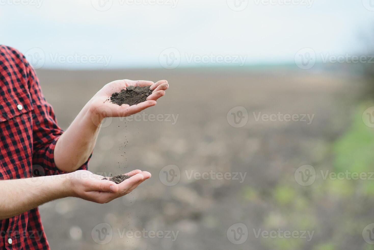 Soil in farmer arms. image with selective focus. photo
